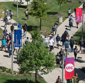 Students walking across campus
                  