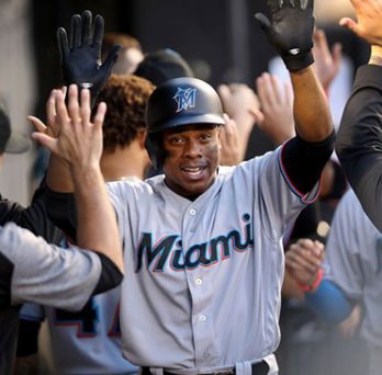 Miami Marlins outfielder Curtis Granderson, a T.F. South graduate, is congratulated in the dugout after hitting a two-run homer against the White Sox at Guaranteed Rate Field on Tuesday, July 23, 2019. 