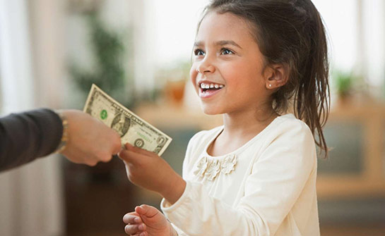 A child accepting a dollar