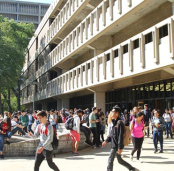 UIC students walking outside of the library 