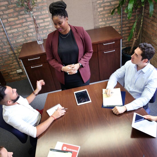 Students around a boardroom table