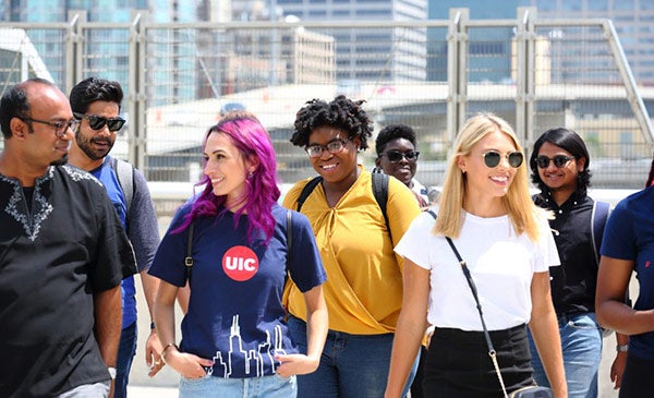 Group of students walk the quad