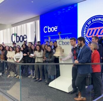 UIC Business faculty and students ring the closing bell of the trading floor at Cboe
                  
