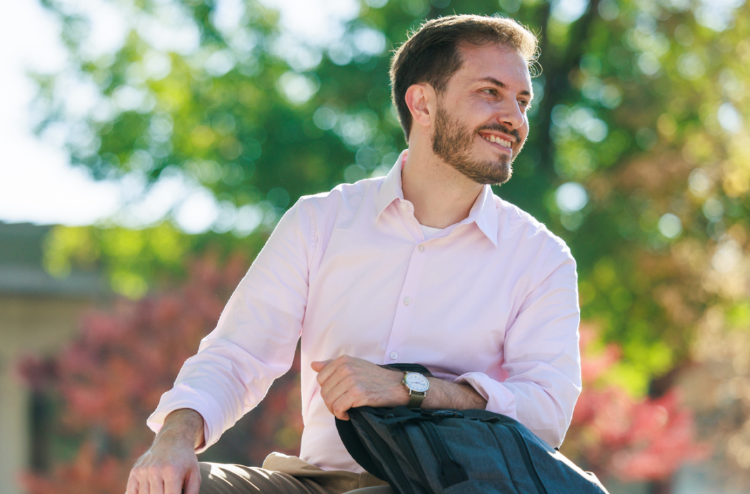 UIC Business MSA student in the quad holding backpack