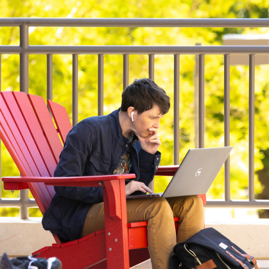 Student on Laptop on UIC Campus