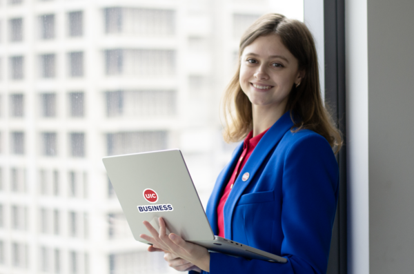 UIC Masters in Marketing Student posing by a window