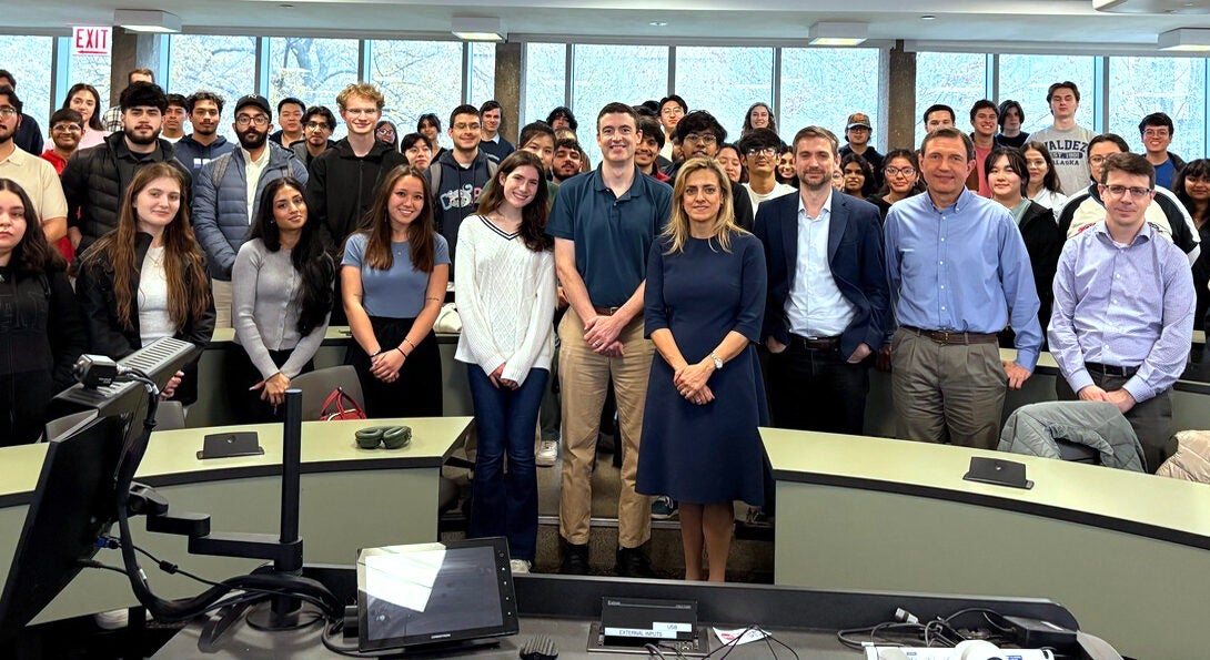 UIC Business Finance Department faculty with students in a classroom.
